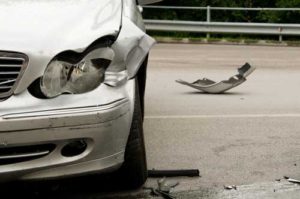 silver car after a crash | Compensation After a Car Accident in Colorado