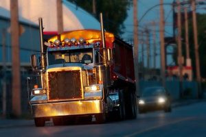 Semi-truck at sunrise | Could Autonomous Vehicles Make Long-Haul Semi-Truck Crashes a Thing of the Past?