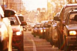 two lanes of traffic on a city street in the afternoon | Car Accident Liability in Colorado