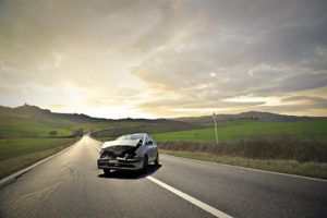 car in the middle of rural highway after crash | Briargate Car Accident Attorneys