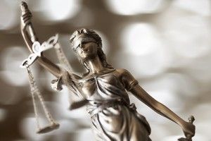 statue of lady justice holding scales | How to Find the Right Car Accident Lawyer
