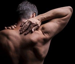 Man touching the back of his neck | Shoulder Injuries from Car Accidents