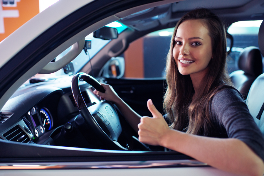 thumbs up female driver