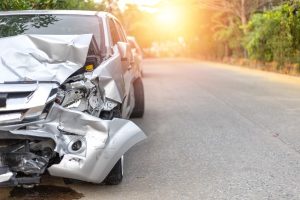 Front of light gray color car with pick up have big damaged | What Happens If You Get Hurt in an Out-of-State Car Accident
