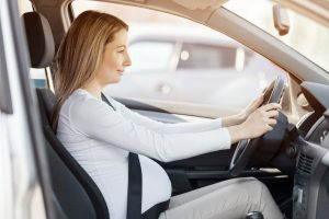 pregnant blonde woman behind the wheel | Why Are Women More Likely to Die in Car Accidents?